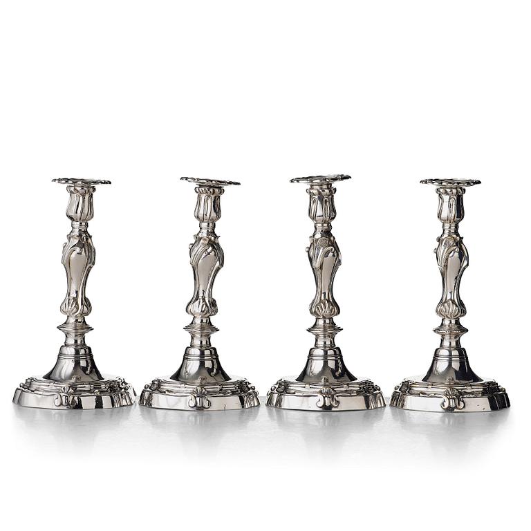 Four Louis XV mid 18th century candlesticks.