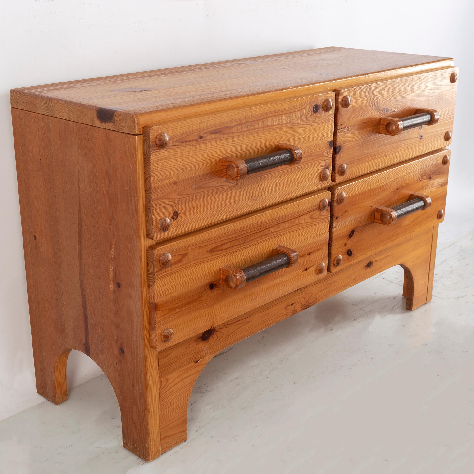 A 1970's set with a pine mirror and chest of drawers.