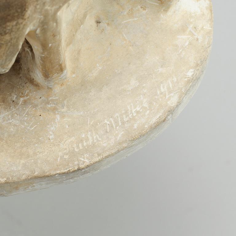 two plaster figurines, signed.