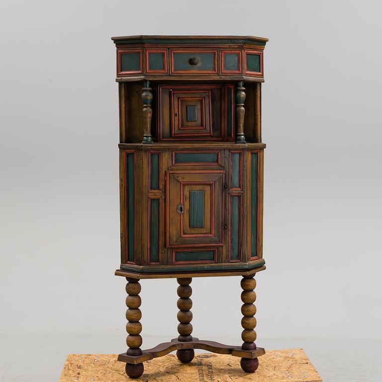 A 18th century corner cabinet.