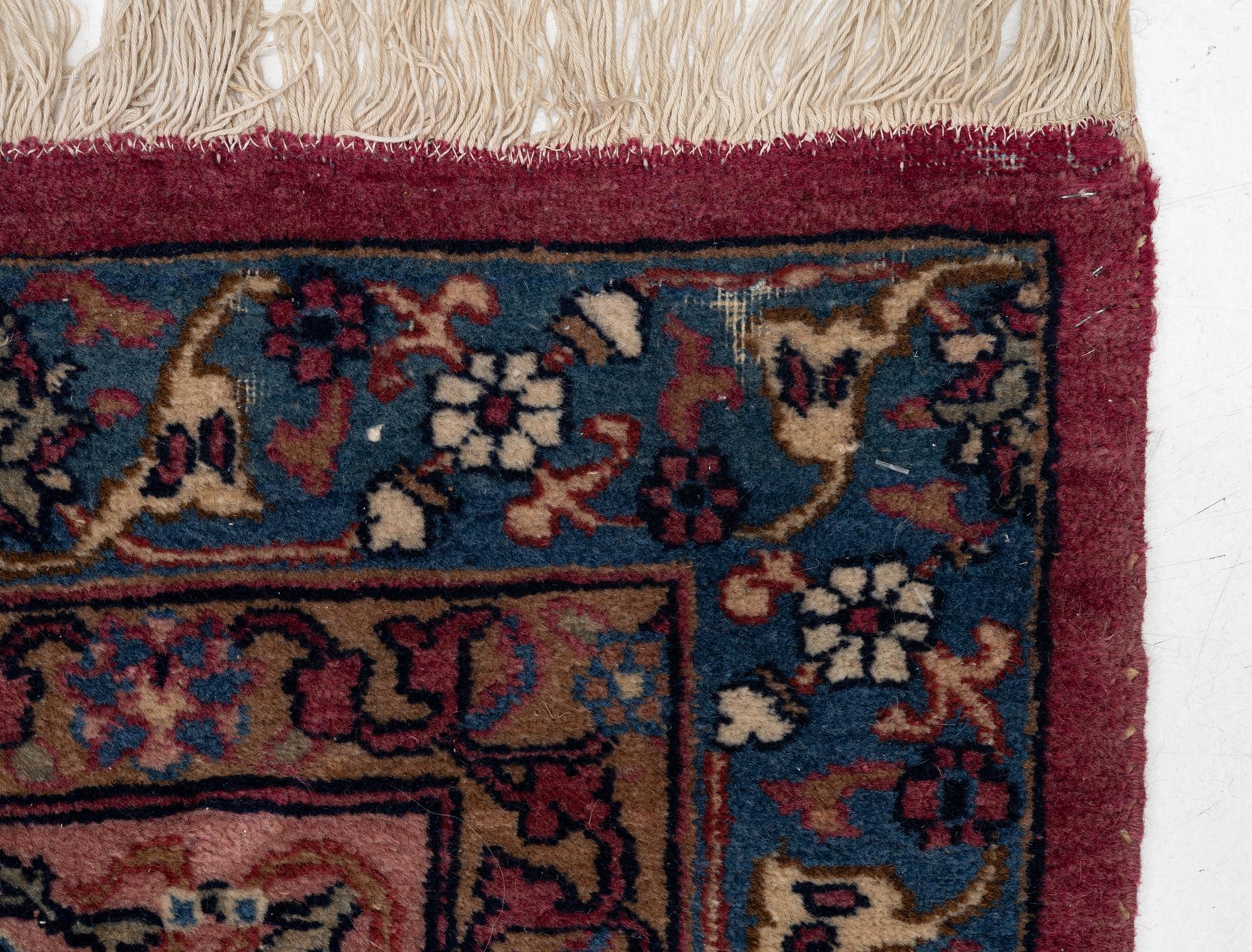 An antique Tabriz carpet, West Persia, c. 447 x 322 cm.