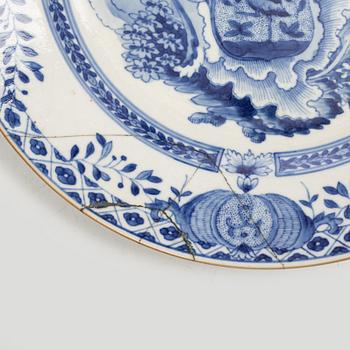 A pair of armorial dinner plates, soft paste, Qing dynasty, 18th century.