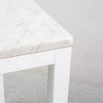 A marble top table, 21th century.