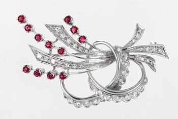 636. BROOCH, set with eight cut diamonds and rubies.