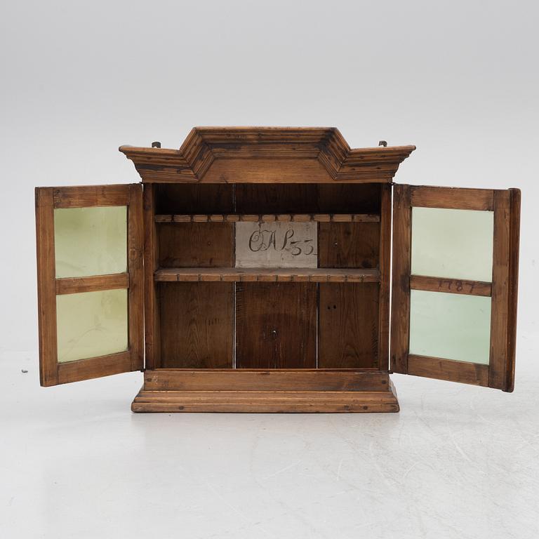 A 18th century wall vitrine cabinet.