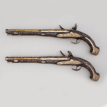 A pair of composite flintlock pistols marked Jalabert Lamotte.