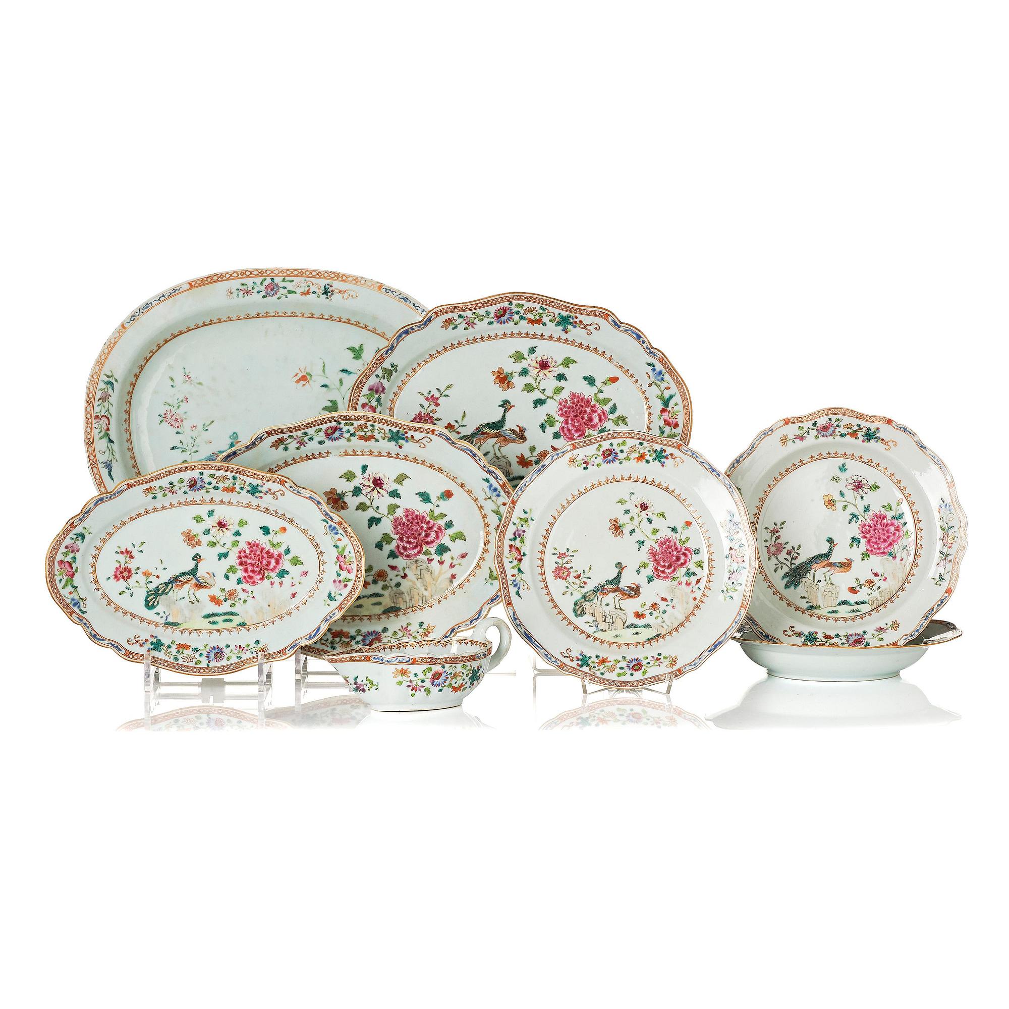 A group of famille rose 'double peacock' serving dishes, Qing dynasty, Qianlong (1736-95). (8 pieces).