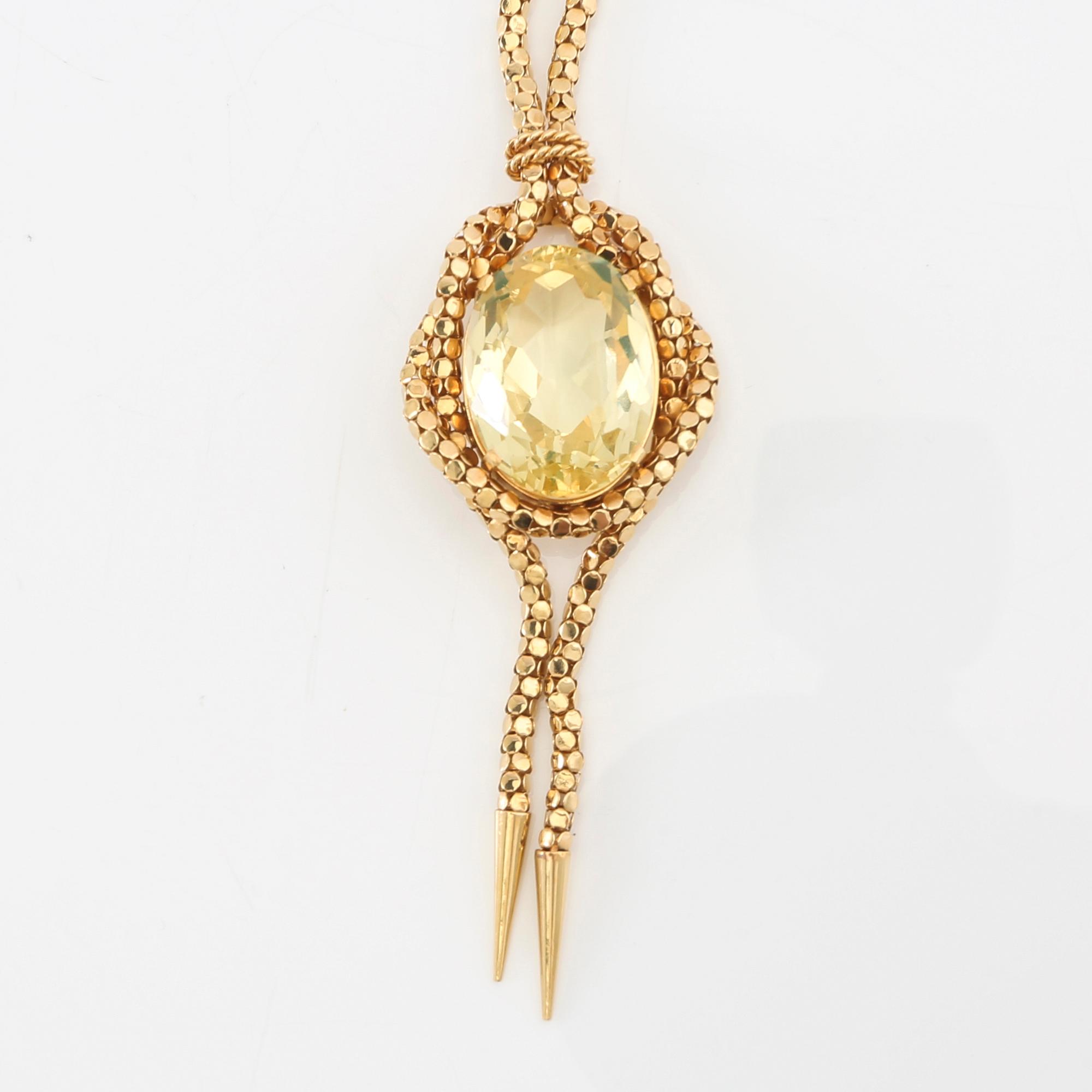 Necklace 18K gold with an oval faceted green synthetic spinel.