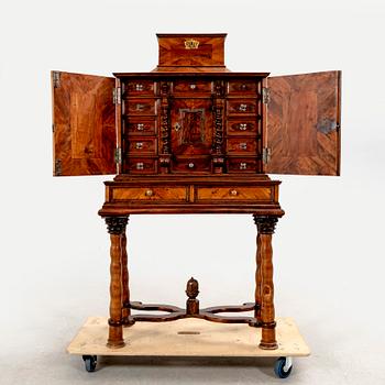 A first half of the 18th century walnut cabinet.