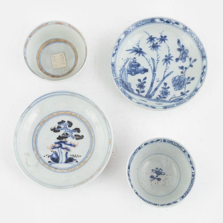 Two Chinese export porcelain cups with saucers, two cups, and a figurine, Qing Dynasty, 18th century.