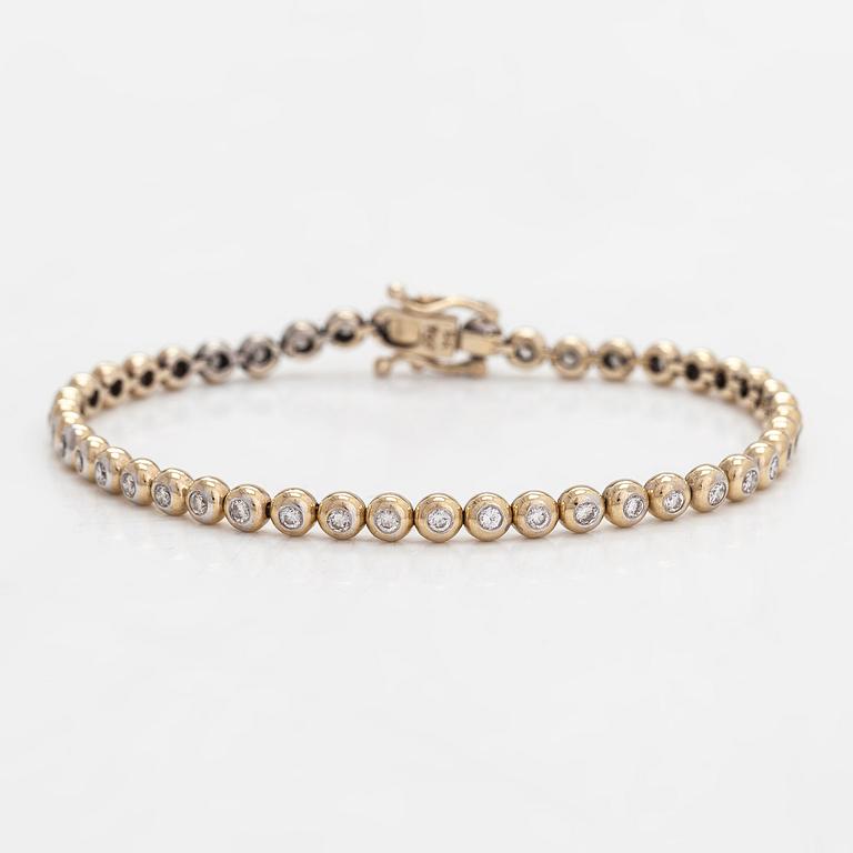 Tennisrannekoru, 18K kultaa ja timantteja yhteensä noin 0.78 ct.