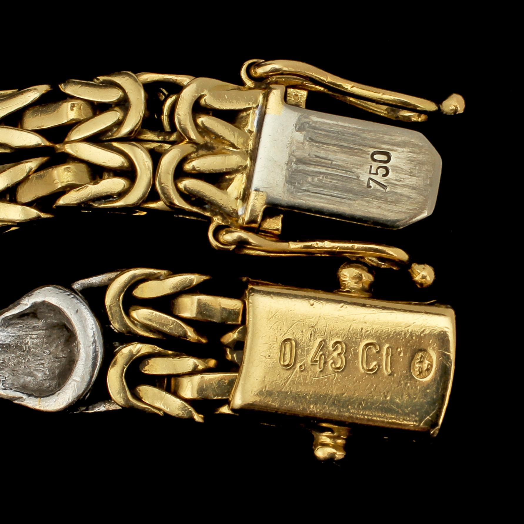 ARMLÄNK, 18k guld och vitguld med 24 små briljantslipade diamanter, tot 0.43 ct, importstämplat. Vikt 28 g.