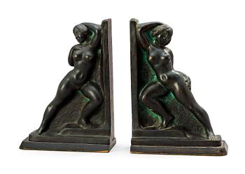 566. A pair of Axel Gute bronze book ends, 1929.