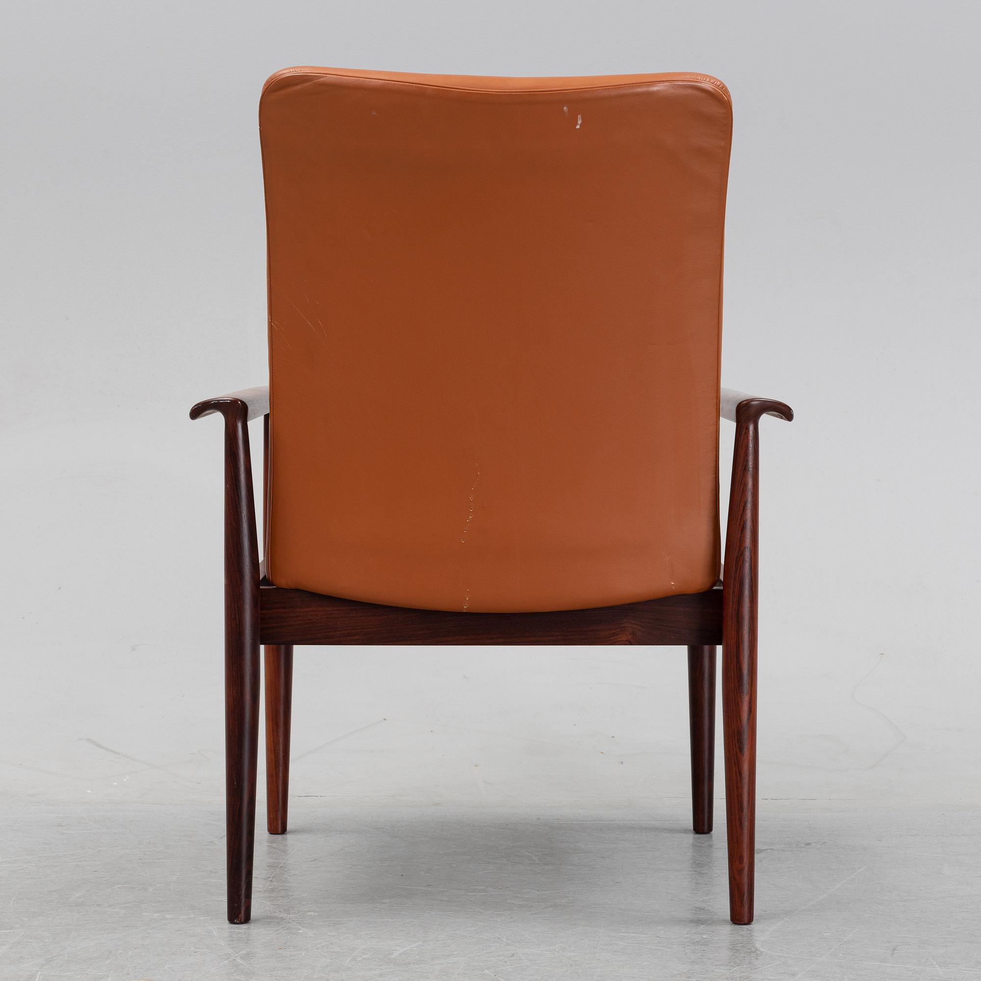 Finn Juhl, a rosewood easy chair, from Cado, Denmark, 1960's/70's.