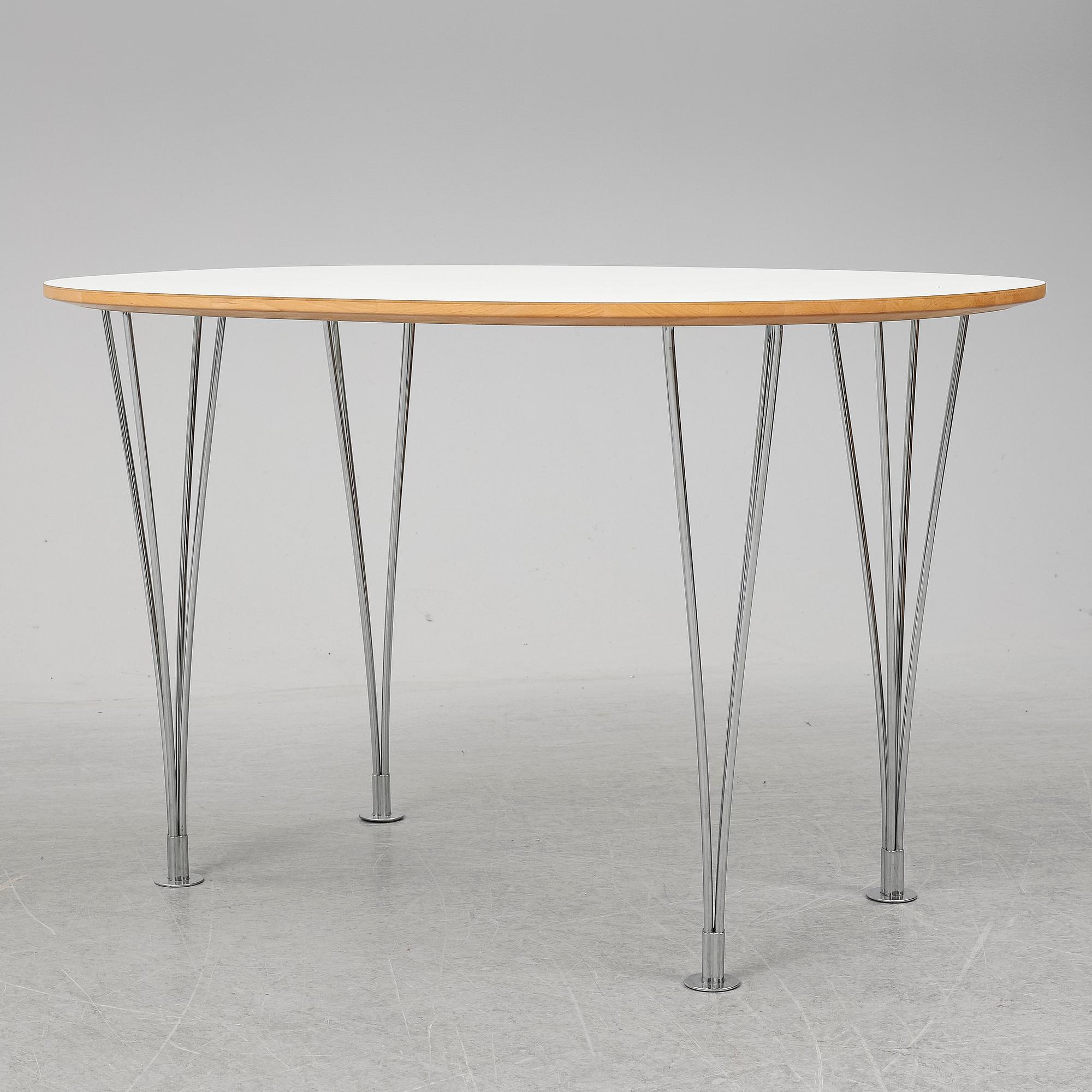 A 'Superellips" table by Bruno Mathsson & Piet Hein for Mathsson International darted 2011.
