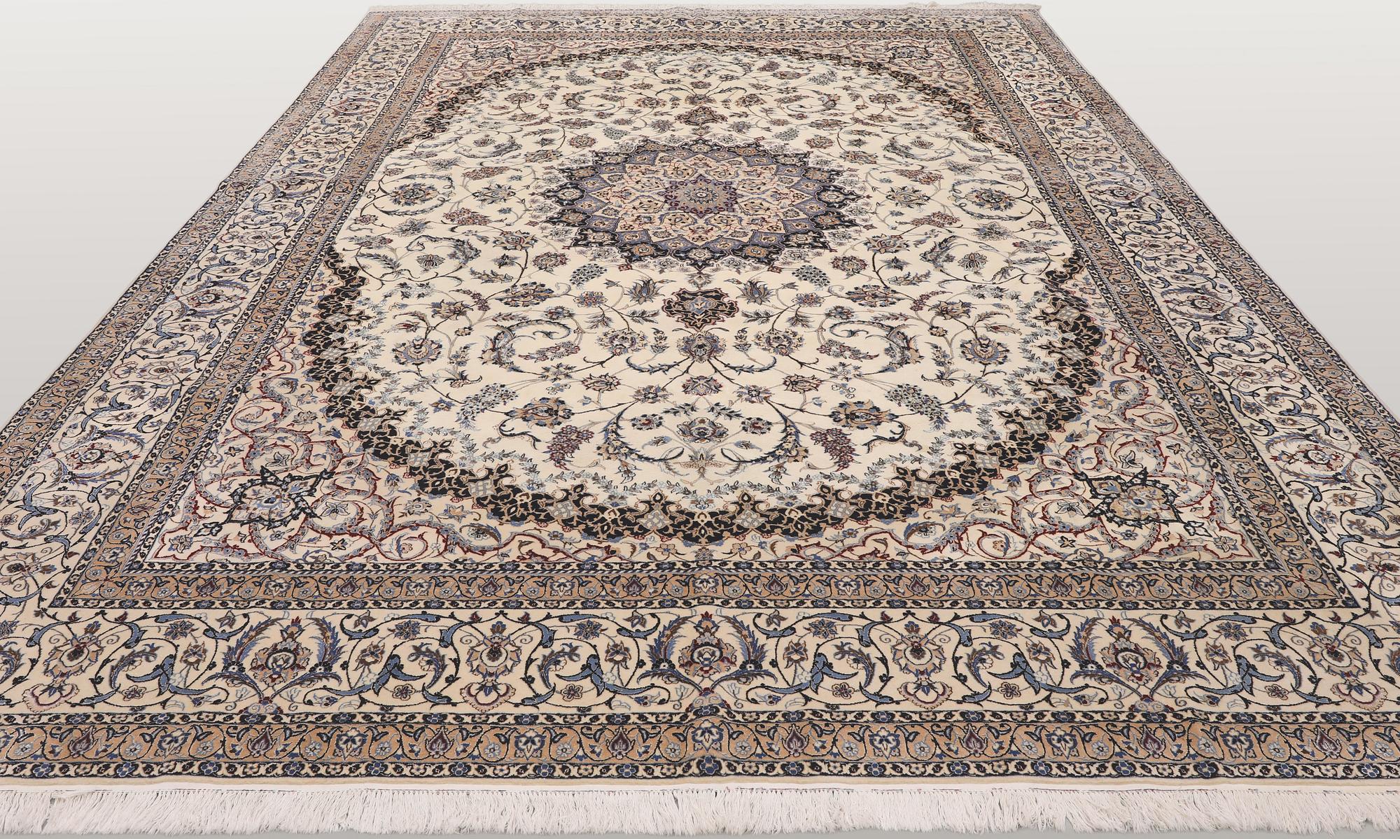 A Nain part silk carpet, 407 x 304 cm.