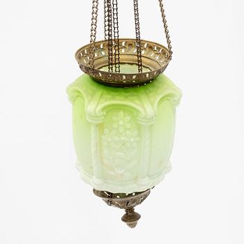 An art noveau glass and brass ceiling lamp from around the year 1900.