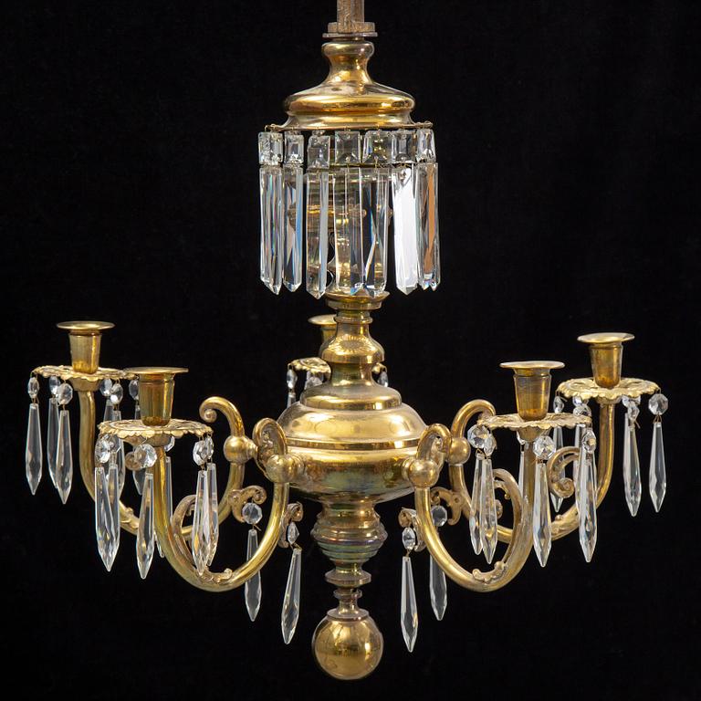 A brass chandelair, around the year 1900.