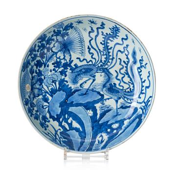 1097. A blue and white 'phoenix and peony' dish, Qing dynasty, Kangxi (1662-1722).