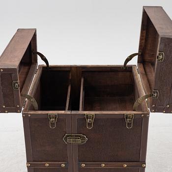 A leather suitcase-shaped bar cabinet.