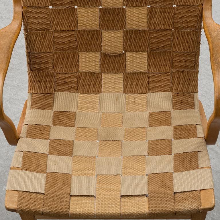 A armchair, model "Eva hög", designed by Bruno Mathsson for Firma Karl Mathsson, dated 1941.