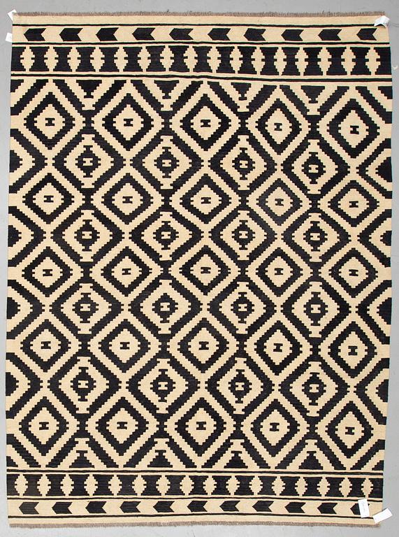 A CARPET, kilim, ca 292 x 217 cm.