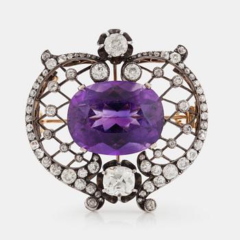 A BROOCH set with an amethyst and old-cut diamonds.