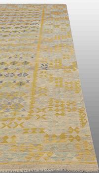 An oriental kilim, around 491 x 308 cm.