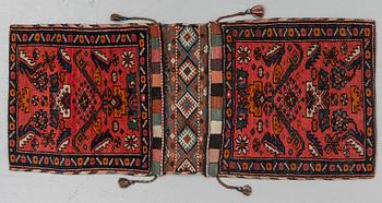 A semi-antique west persian saddlebag, circa 127 x 54,5 cm.