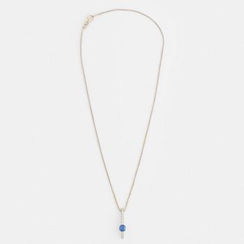 An 18K white gold necklace with a faceted sapphire.