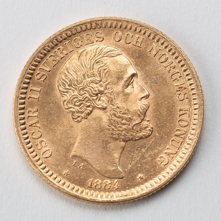 MYNT, guld, 20 kronor, Oscar II, 1884, vikt ca 9 g.