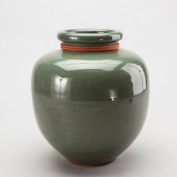 A Japanese eraly 20th century stoneware jar.