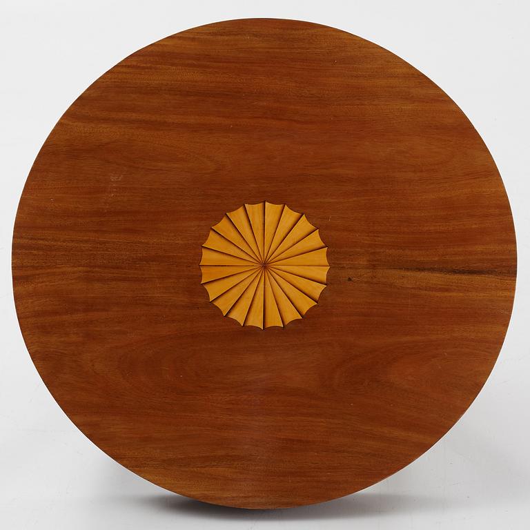 A mahogany veneered Empire style table, first half the 20th Century.