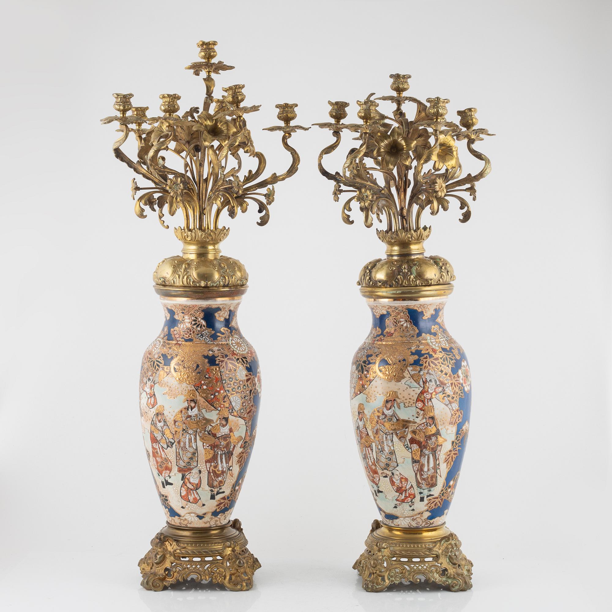 A pair of gilt-brass and satsuma ware seven-light candelabra, the porcelain Meiji period (1868-1912).