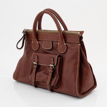 Chloé, a brown leather handbag.