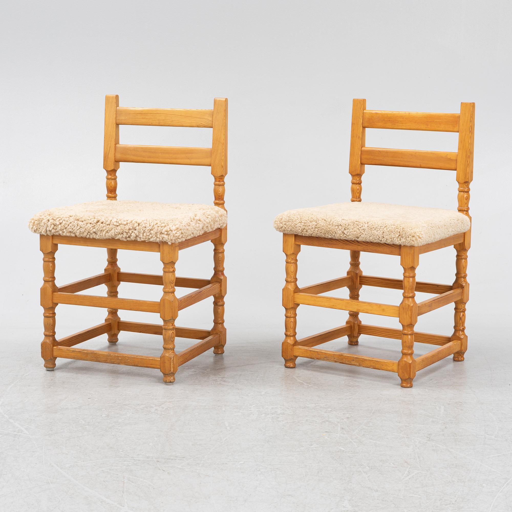 A set of eight pine chairs with new sheepskin upholstery, 1970s.