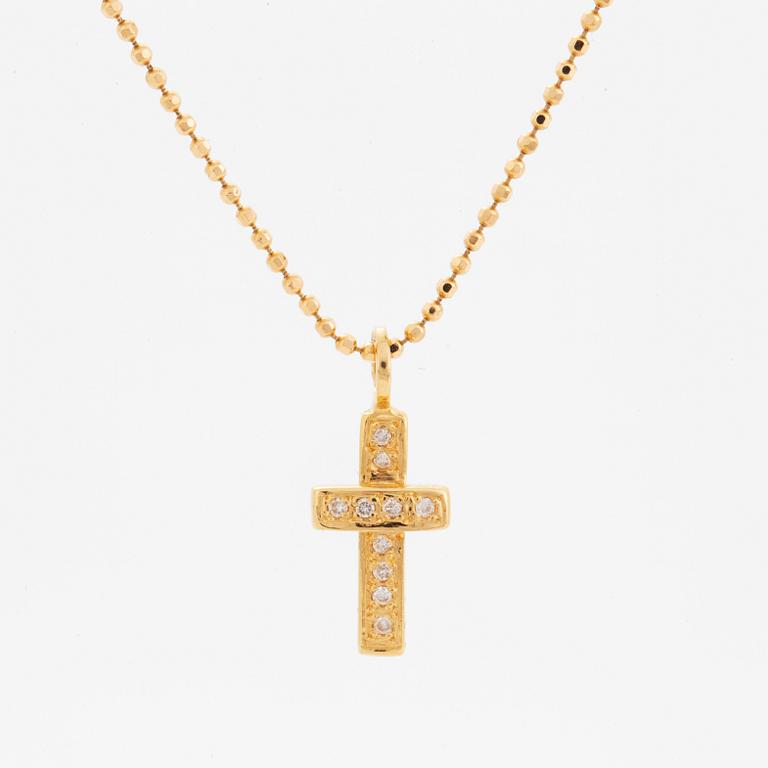 Efva Attling, 18K gold and brilliant-cut diamond cross pendant.