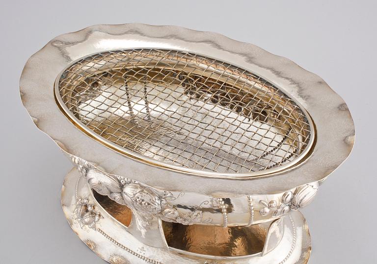 A silver jardinièr by C G Hallberg from Stockholm in 1906.