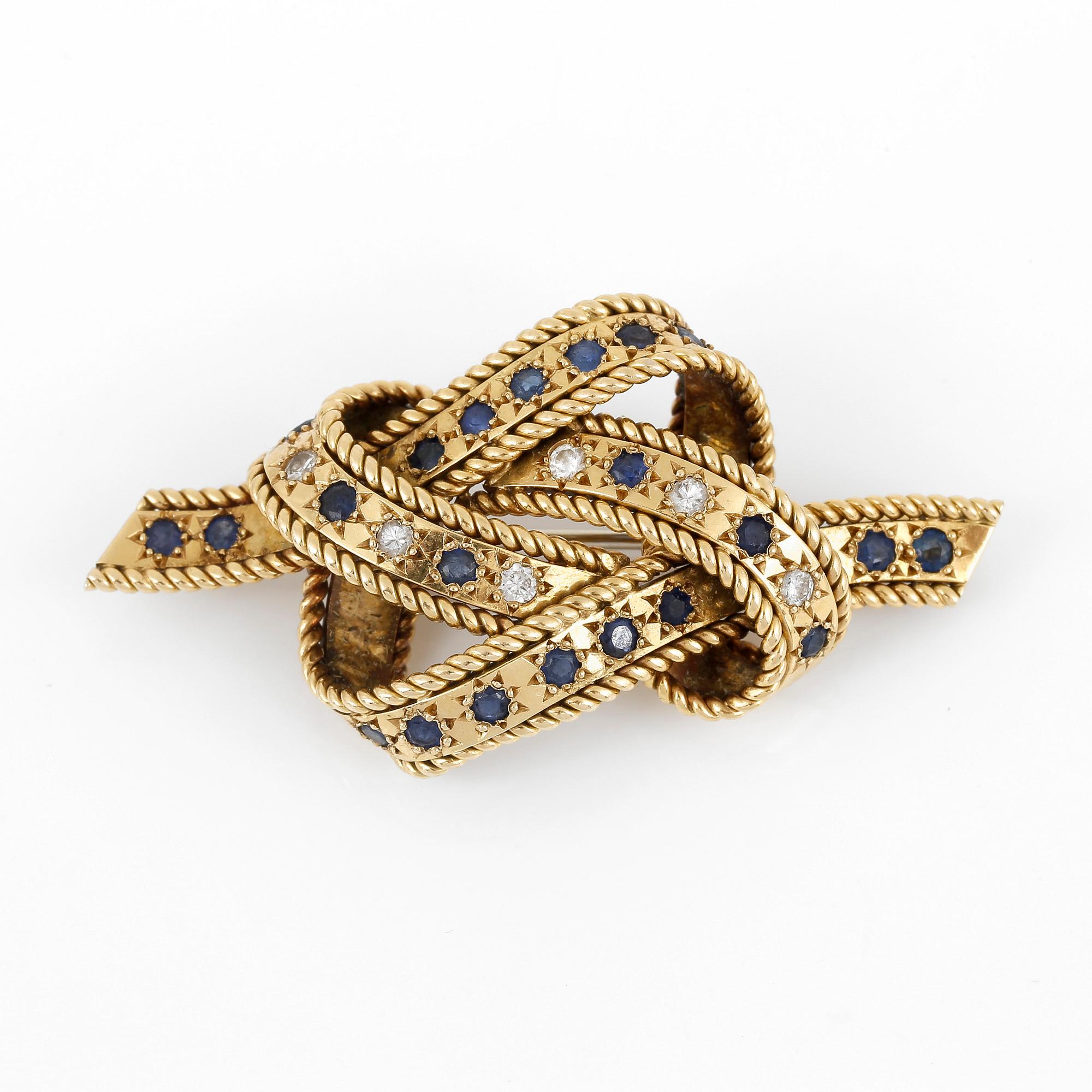 BROSCH, med briljantslipade diamanter, ca 0,24 ct och troligen fasetterade safirer.