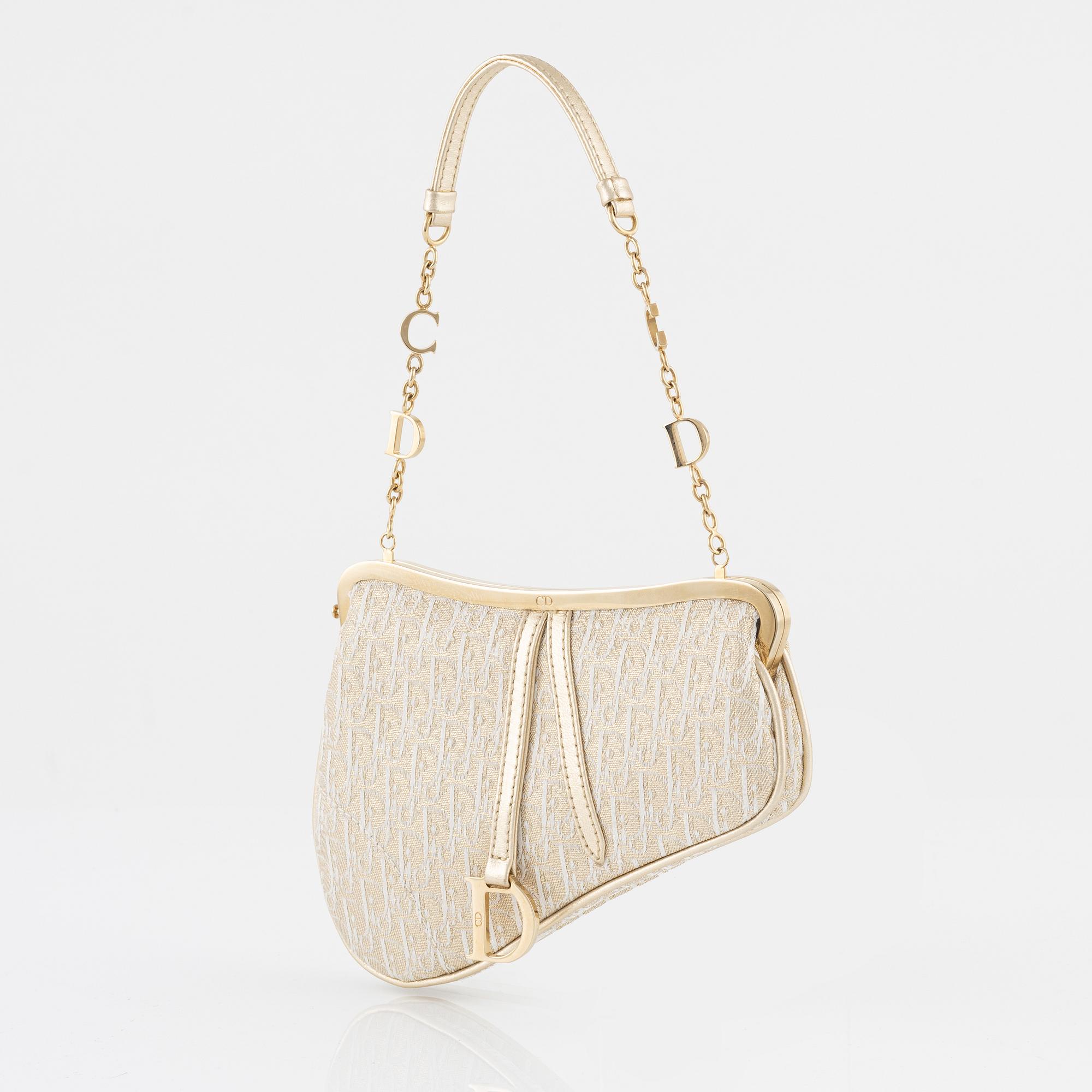 Christian Dior, A vintage 'Mini saddle clutch'.