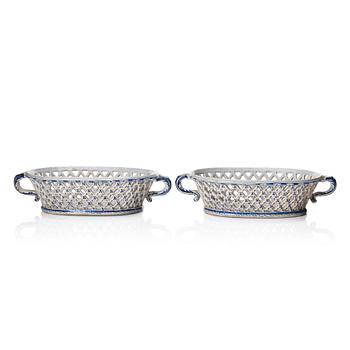 A pair of Swedish Rörstrand faience chesnut baskets, both dated 23/1 1759.