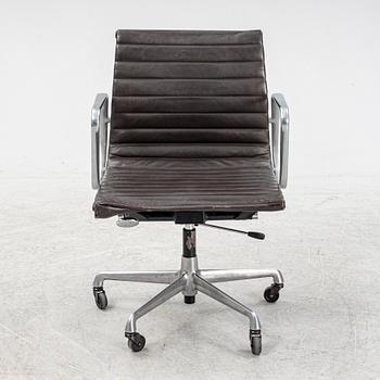 An EA 118 swivel office chair by Charles and Ray Eames for Herman Miller.