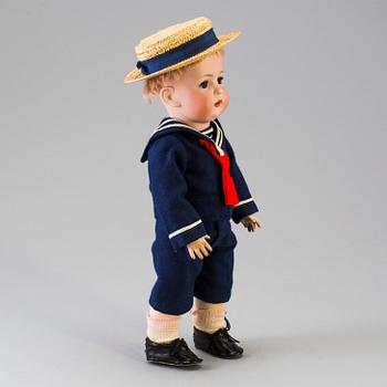 A bisque head boy doll by Baehr & Proeschild for Bruno Schmidt, Germany, ca 1920.