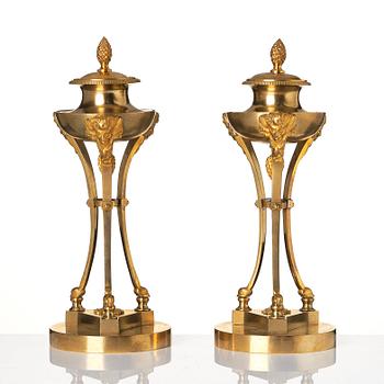 A pair of Empire tripod shaped casolettes.