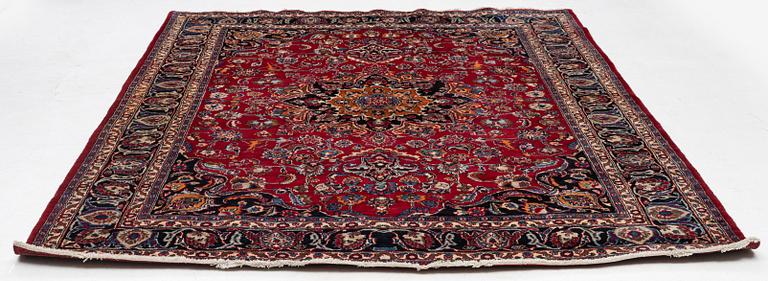 A carpet, Oriental, c. 335 x 257 cm.