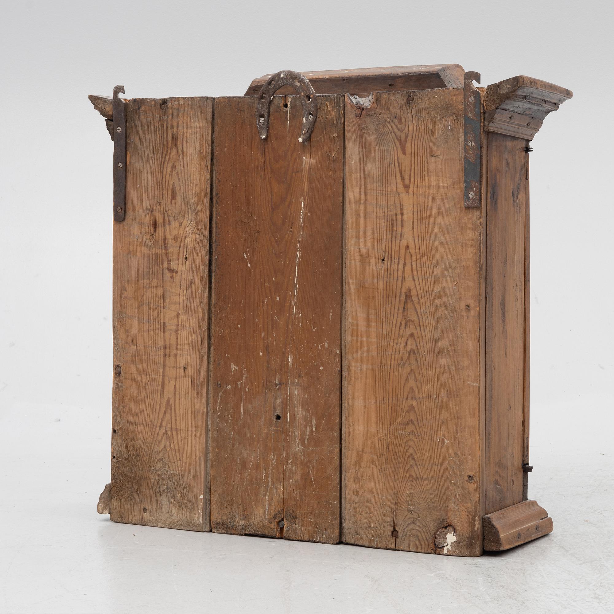 A 18th century wall vitrine cabinet.