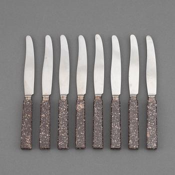 A set of eight porphyr knives, early 20th century.