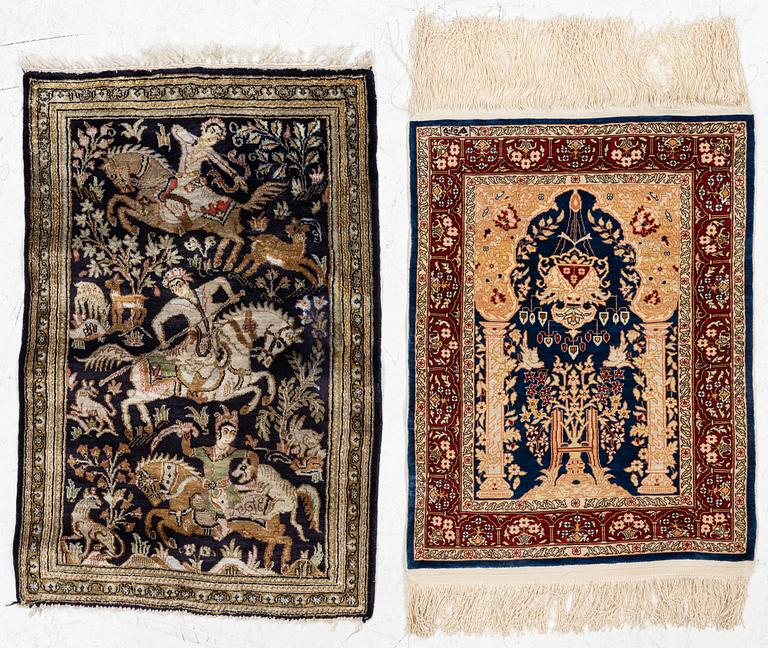 Carpets, two smaller Hereke and Ghom, silk.