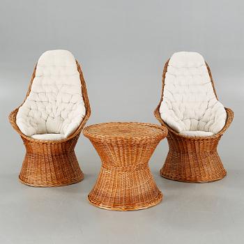 A pair of chairs and one table from the latter half of the 20th century.