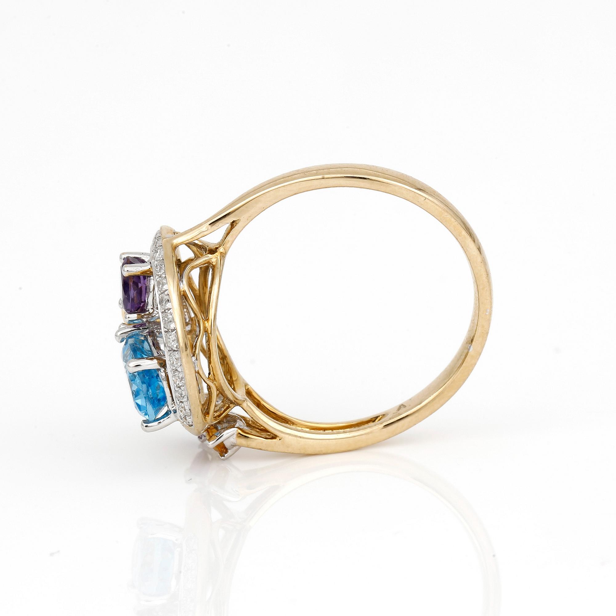 RING, 14K guld med citriner, ametister, blå topas och små diamanter. Vikt ca 3,70 g.